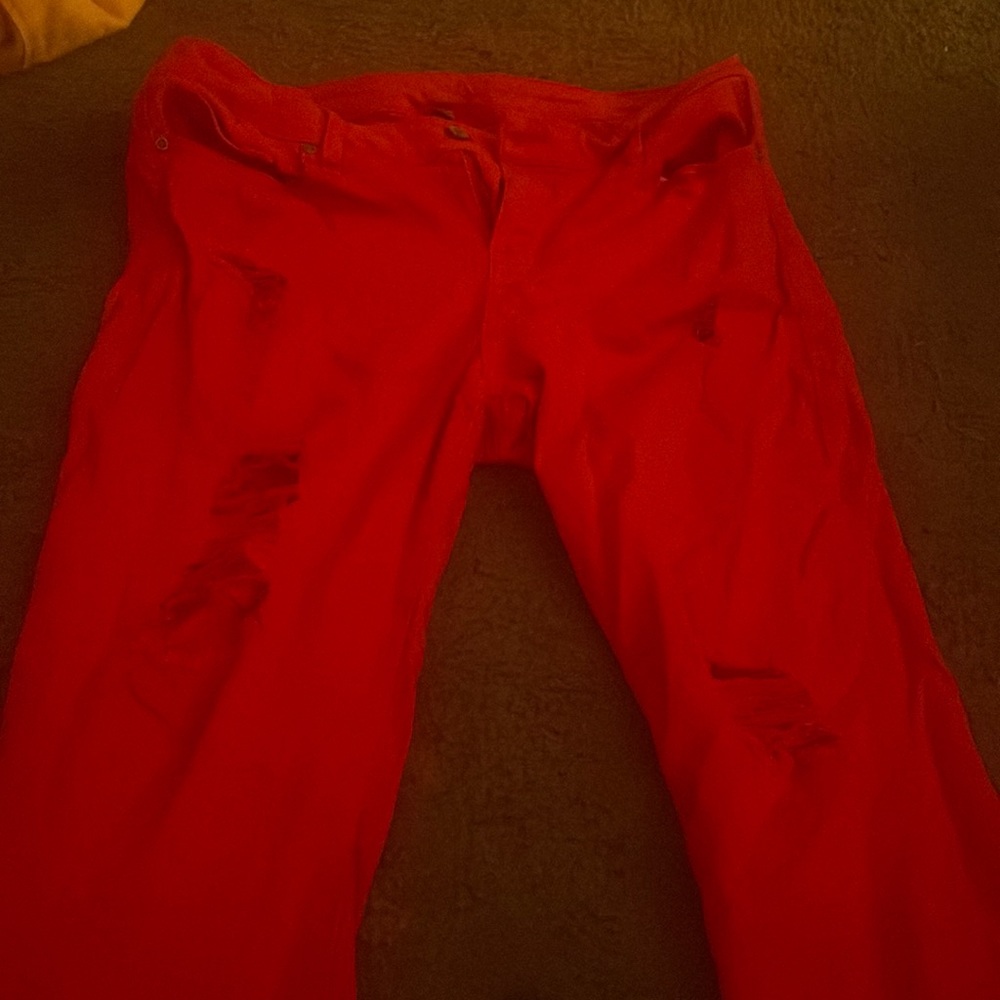 Red ripped short pants ,